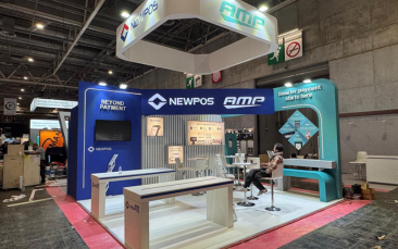 Custom trade show booth for NEWPOS & AMP by Expo Creators, featuring bold blue design and professional fabrication.