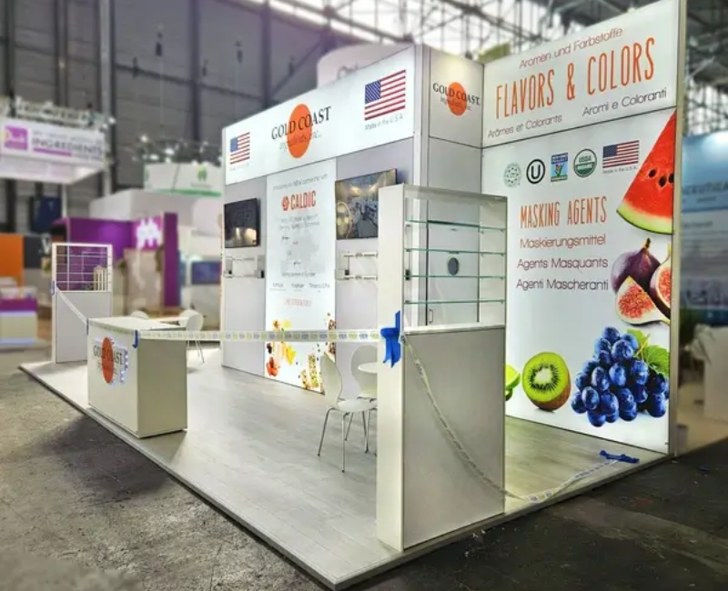  TradeShow Booth Design-expocreators, Custom Trade Show Booth by Expo Creators for Gold Coast Flavors & Colors, featuring turnkey fabrication, vibrant graphics, and storage solutions.